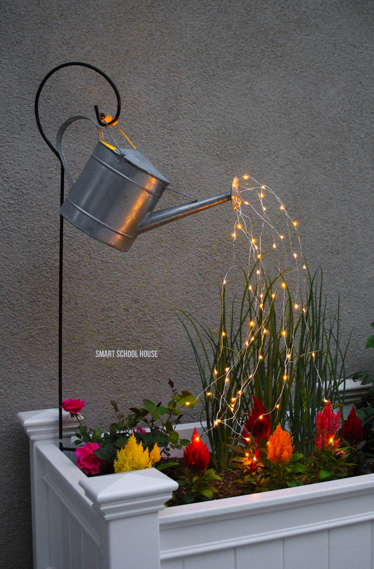 Glowing watering can with fairy lights for a pretty DIY Yard Idea