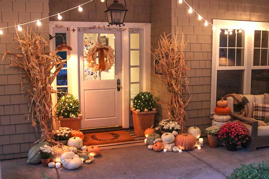 fall front porch with pumpkins