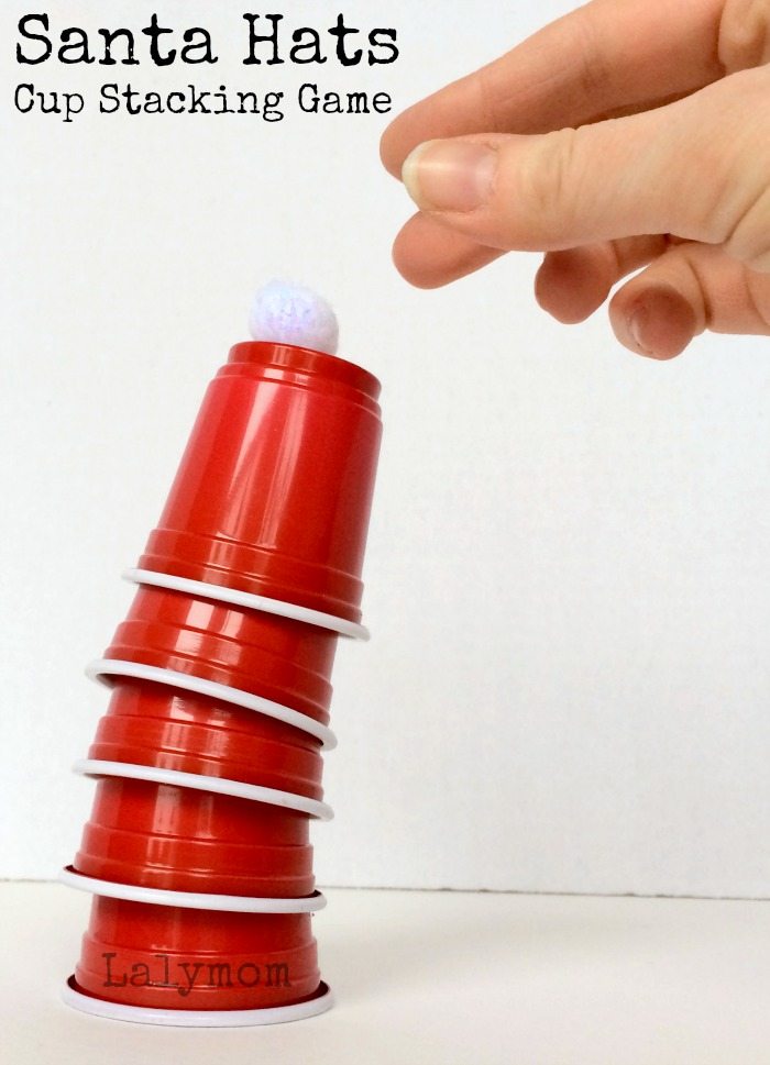 Santa Hat Stack - The BEST Christmas Minute To Win It Games for kids and family. These are so much fun to play around the holidays. #christmas #family #fun #kids 