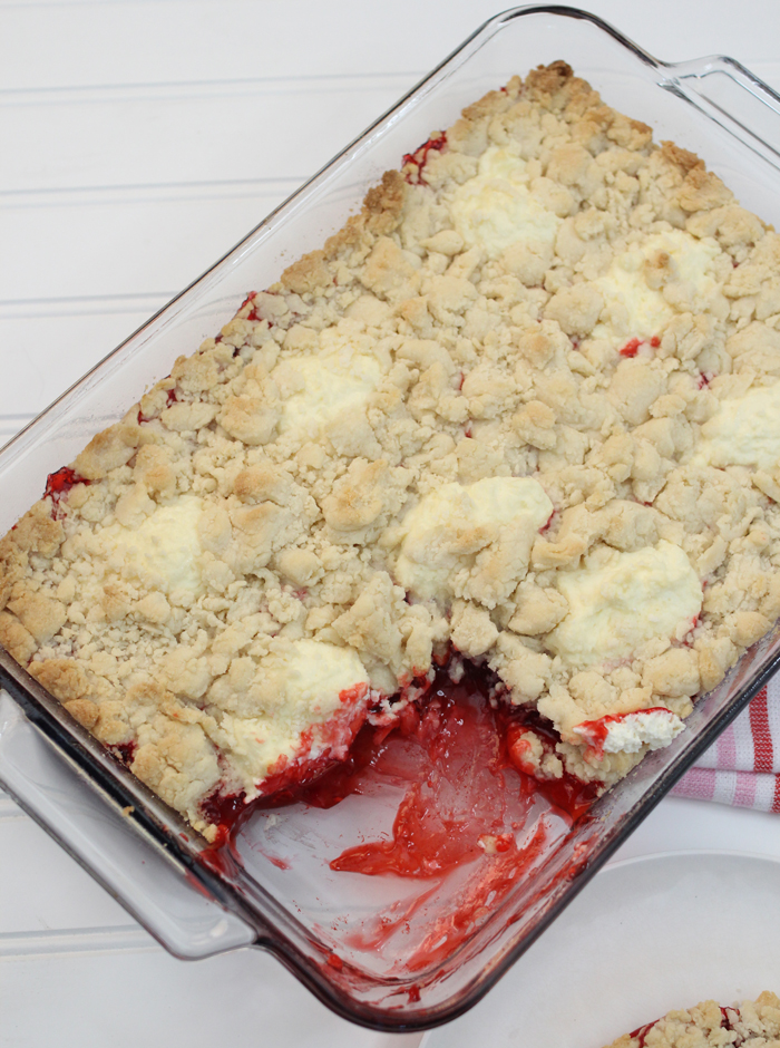Strawberry Cheesecake Dump Cake is a super simple, four ingredient recipe that's ready in just thirty minutes. 
