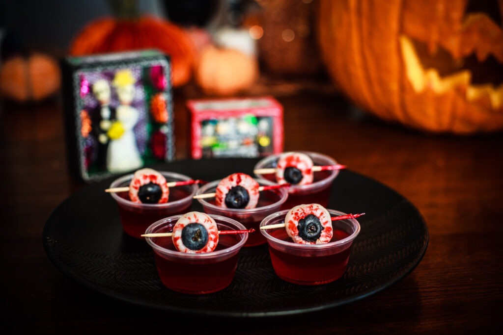 Cranberry jello shots with "bloody eyeballs" for Halloween