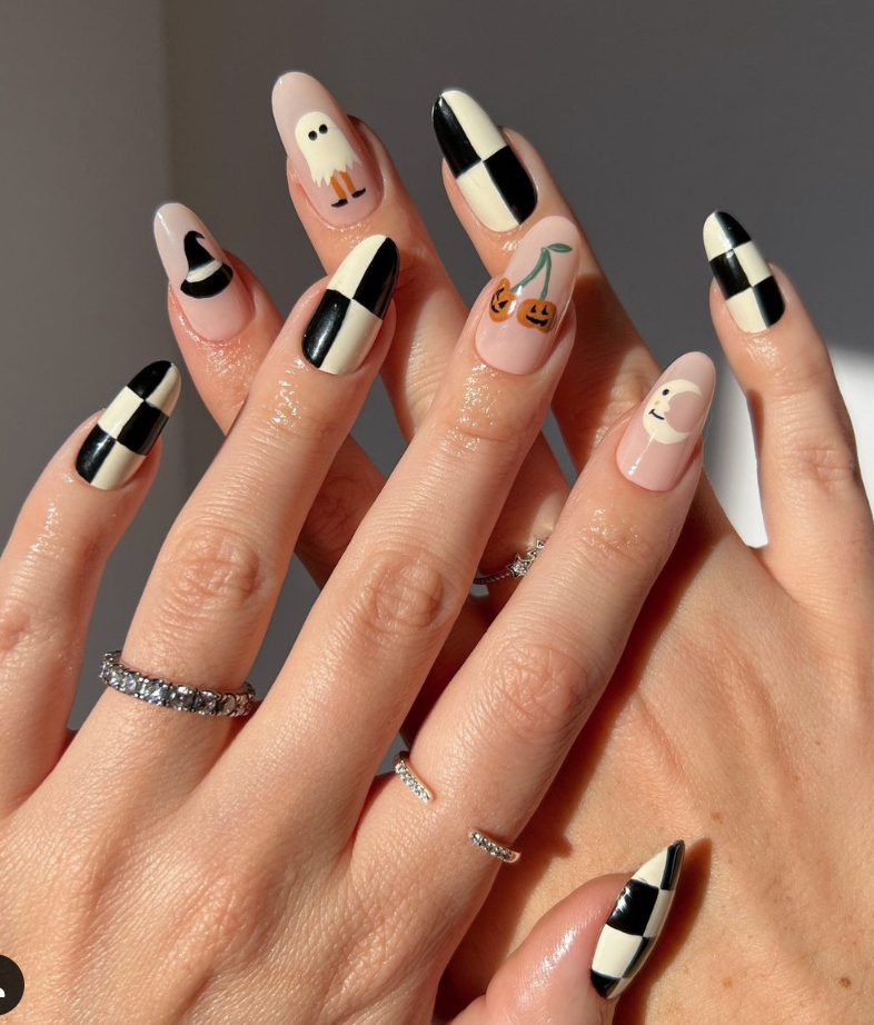 Black and White Halloween Nails with a checkered pattern, a ghost and a witch hat.