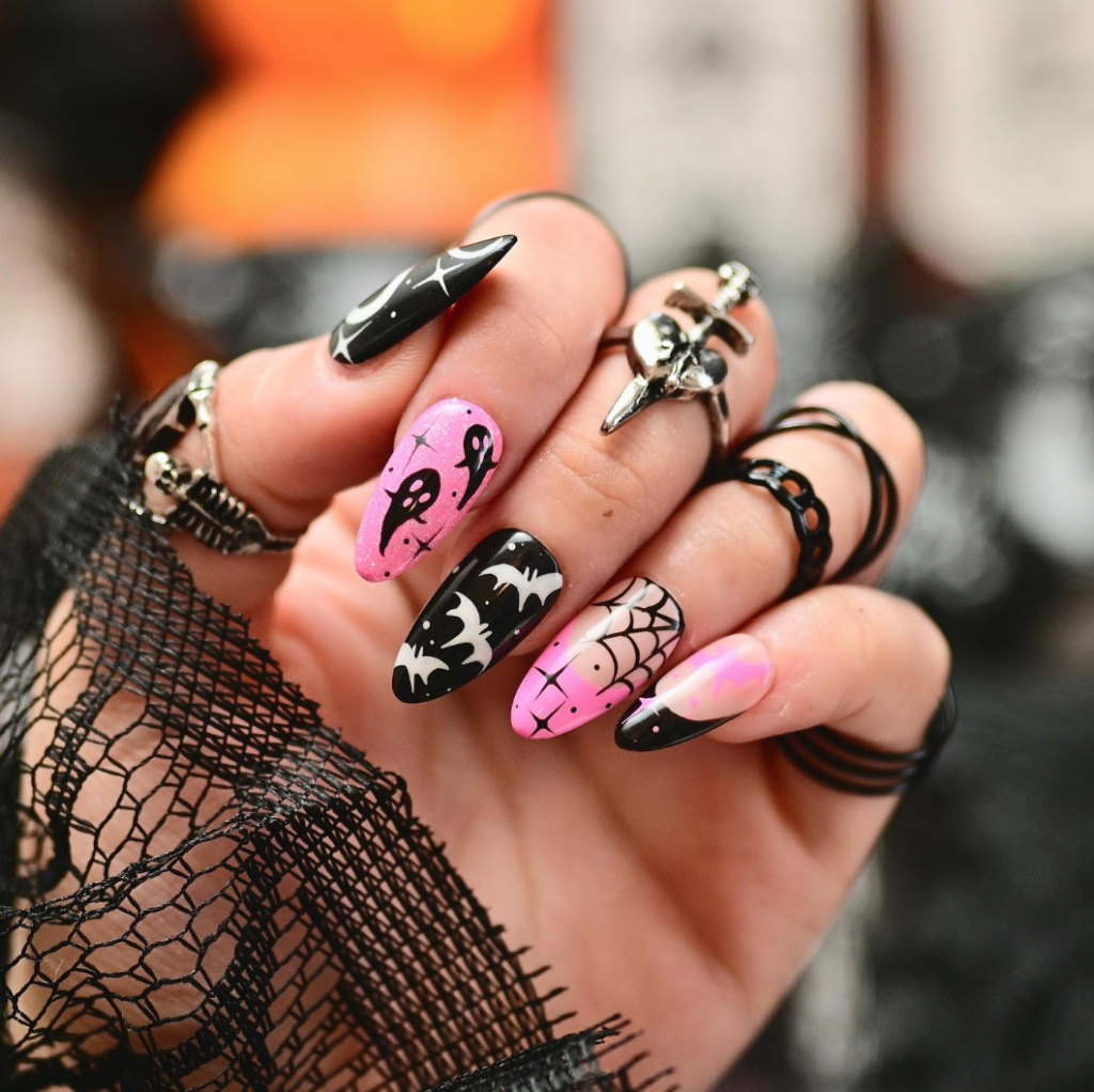 Beautiful Pink & Black Halloween nails with cute ghosts, bats and cobwebs. 