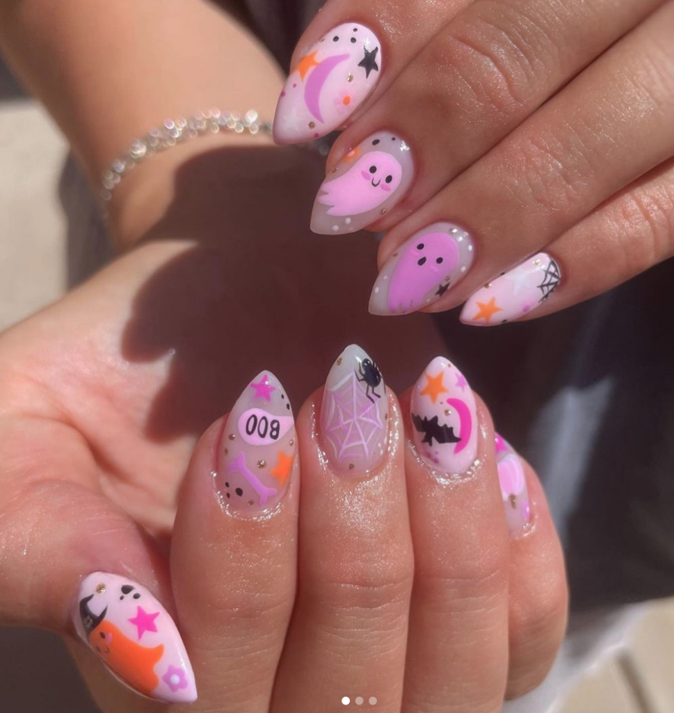 Cute Pink Halloween Nails with adorable ghosts, bats, spiders and stars.